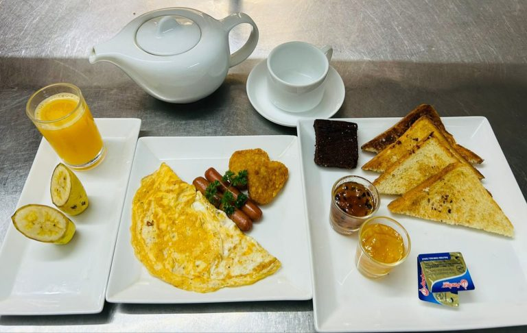 Youth Fame breakfast with eggs, toast, fruit, juice, tea and coffee